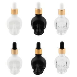 Skull Bitters Bottle In Black, White And Clear